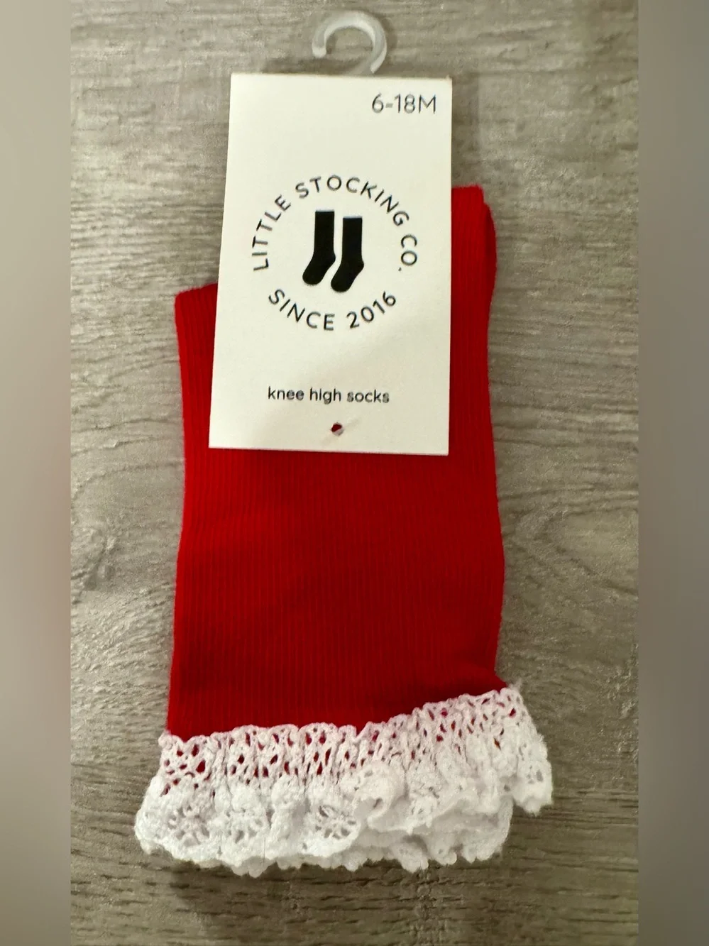 Little Stocking Co. — Red knee-high socks with lace trim at the top. Size:6-18 m